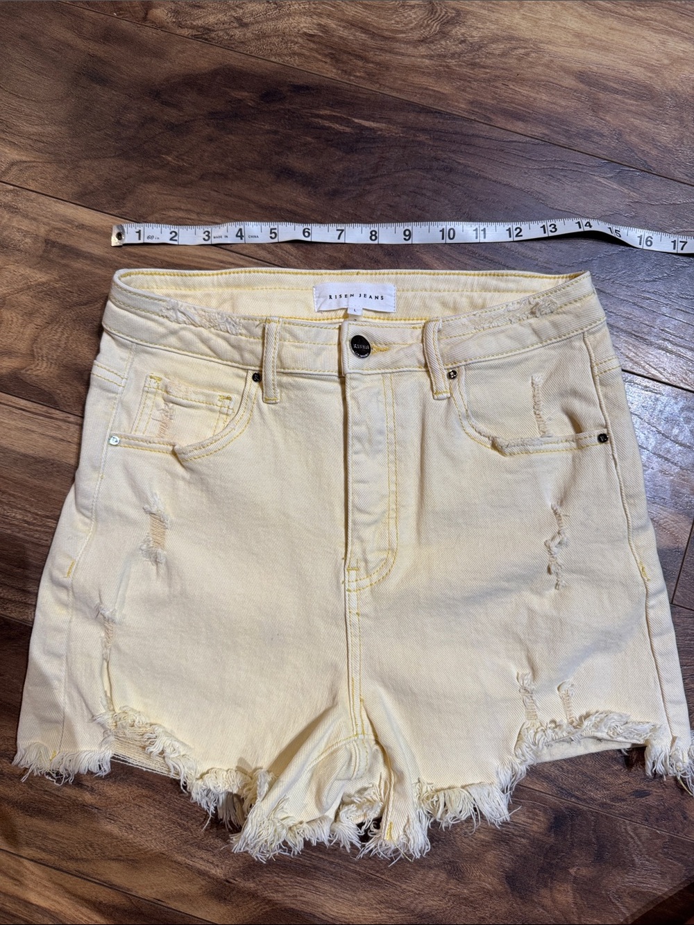 Light Yellow Distressed Denim Cutoff Shorts